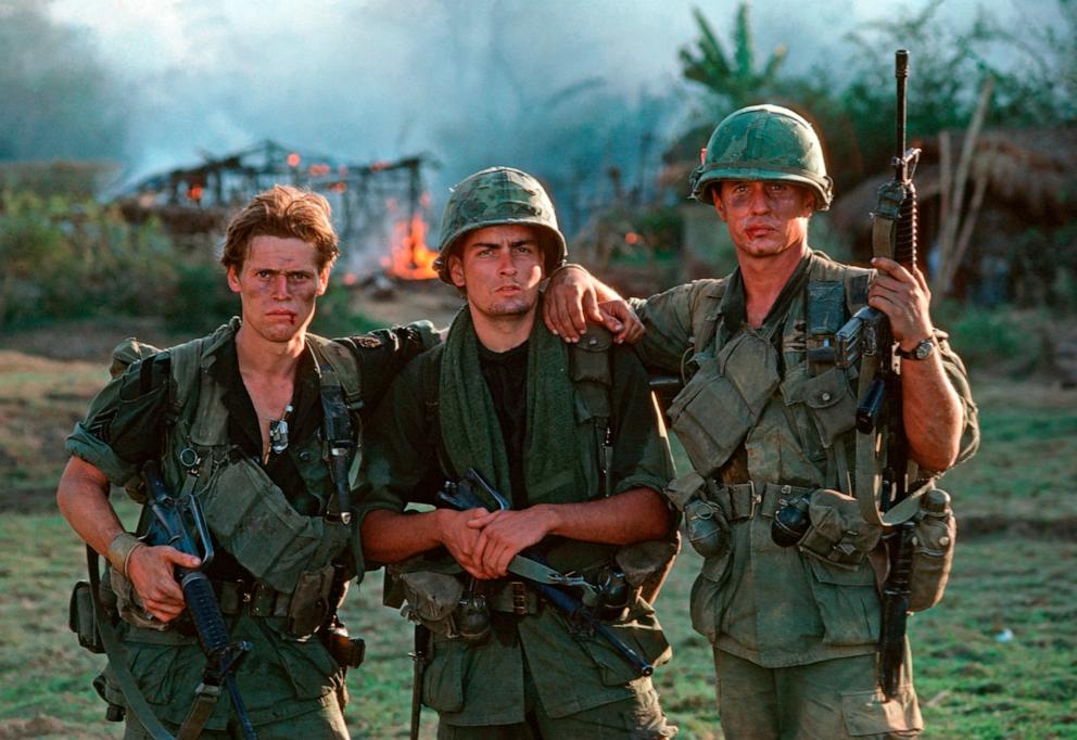 PHOTO: During the filming of Oliver Stone's 1986 film "Platoon," at a location near Manila, actors Willhem Dafoe, left, Charlie Sheen, center, and Tom Berenger pose for a photo. 