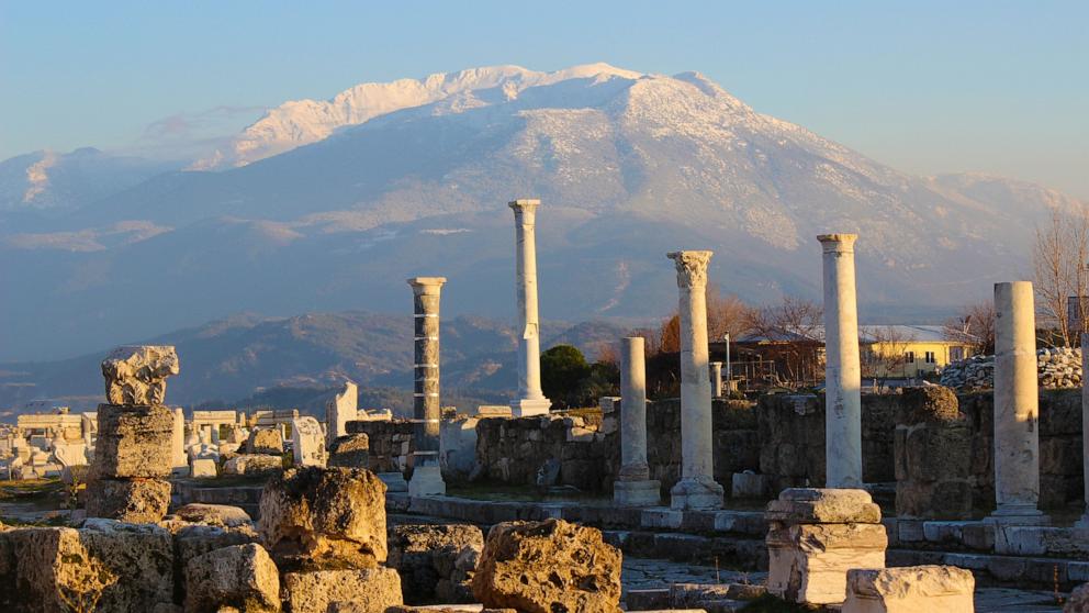 PHOTO: View of the ruins of Pompeii in Italy with Mount Vesuvius in the background.