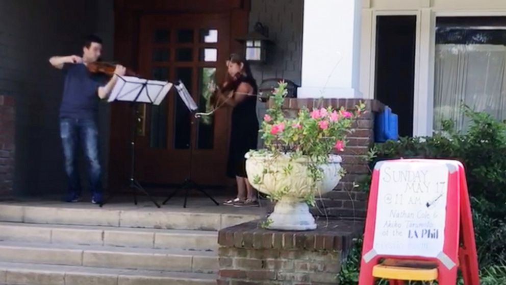 PHOTO: Beong-Soo Kim and wife Bonnie Wongtrakool had guest performers from the Los Angeles philharmonic perform on their porch for the neighborhood in Pasadena, California during the novel coronavirus shutdown.