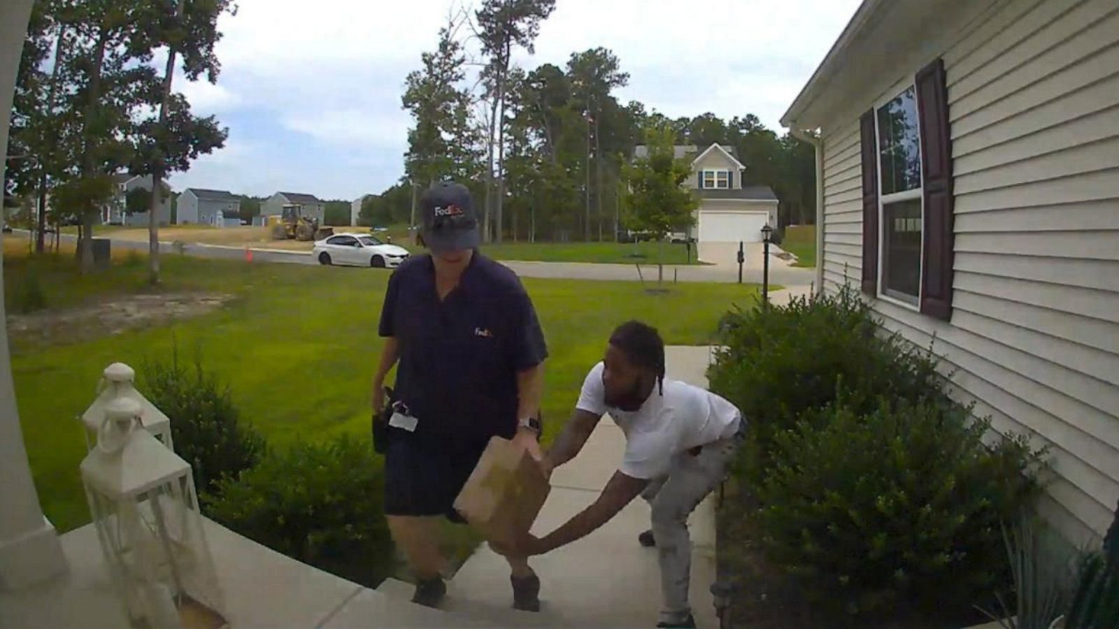 PHOTO: A person is seen stealing a package right from a delivey driver's hand on Aug. 24, 2023.