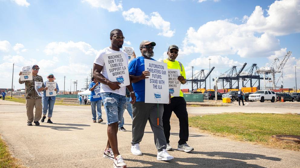 PHOTO: Longshoremen walk the picket line outside of the Barbours Cut Container Terminal during the first day of a dockworkers strike, Oct. 1, 2024, in Houston. 