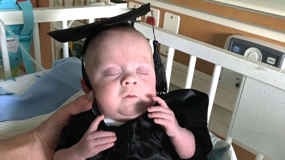 PHOTO: Cullen Potter wears a graduation cap and gown on the day he was discharged from the neonatal intensive care unit.