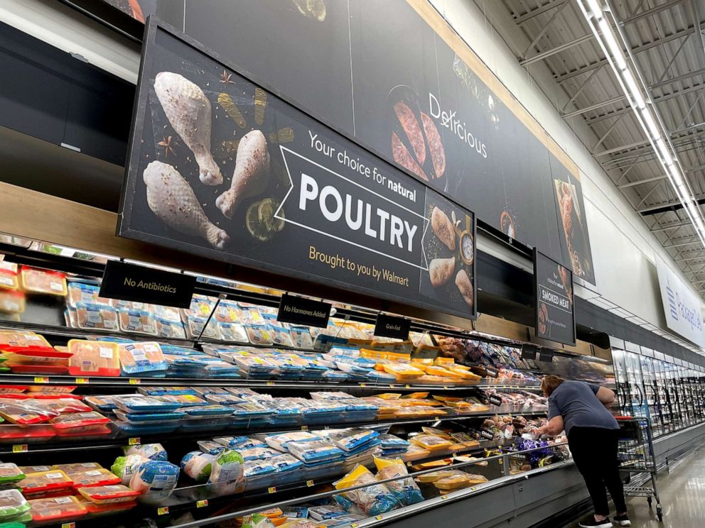 PHOTO: A customer shops for chicken in the Poultry section of a Walmart store in Columbia, Tenn., on Nov. 18, 2021.