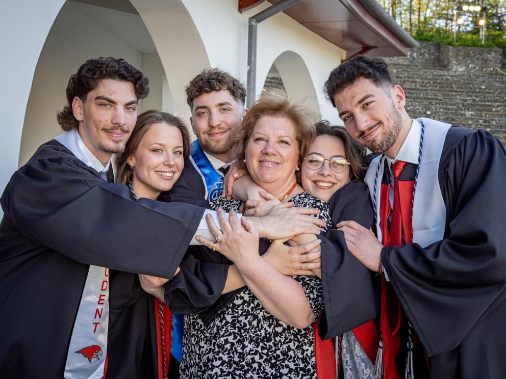 PHOTO: The quintuplets: Michael, Victoria, Ludovico, Ashley and Marcus celebrate their graduation with their mother Silvia Povolo.