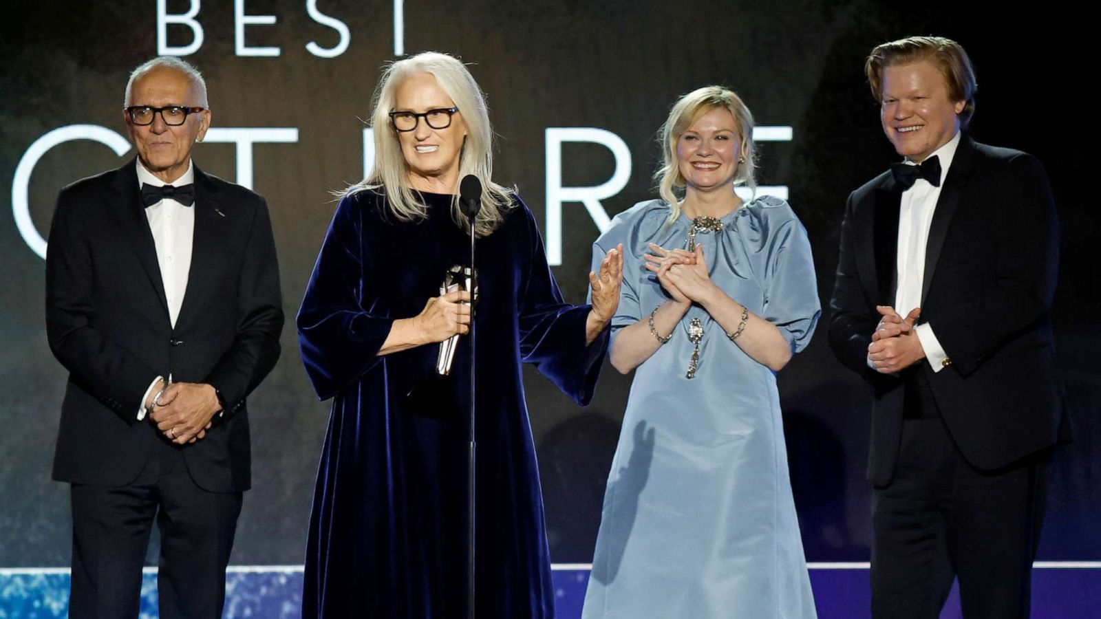 PHOTO: Roger Frappier, Jane Campion, Kirsten Dunst, and Jesse Plemons accept the Best Picture award for 'The Power of the Dog' onstage during the 27th Annual Critics Choice Awards at Fairmont Century Plaza on March 13, 2022 in Los Angeles.