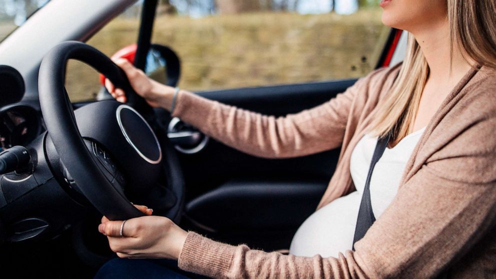 PHOTO: A young woman appears to be driving a car while pregnant in this stock photo.