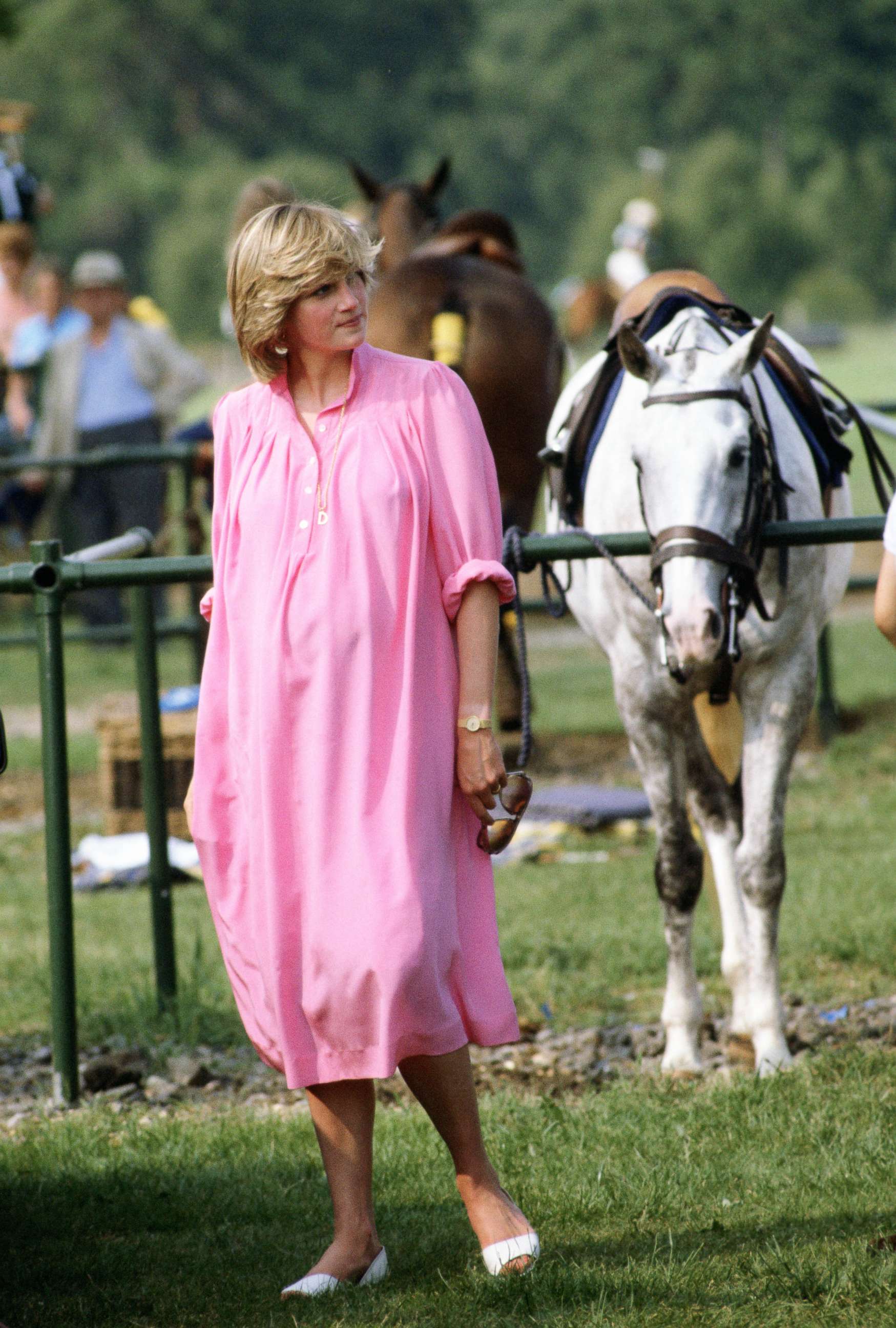 PHOTO: A pregnant Diana, Princess of Wales, walks around a polo field at Windsor in Great Britain, June 4, 1982.