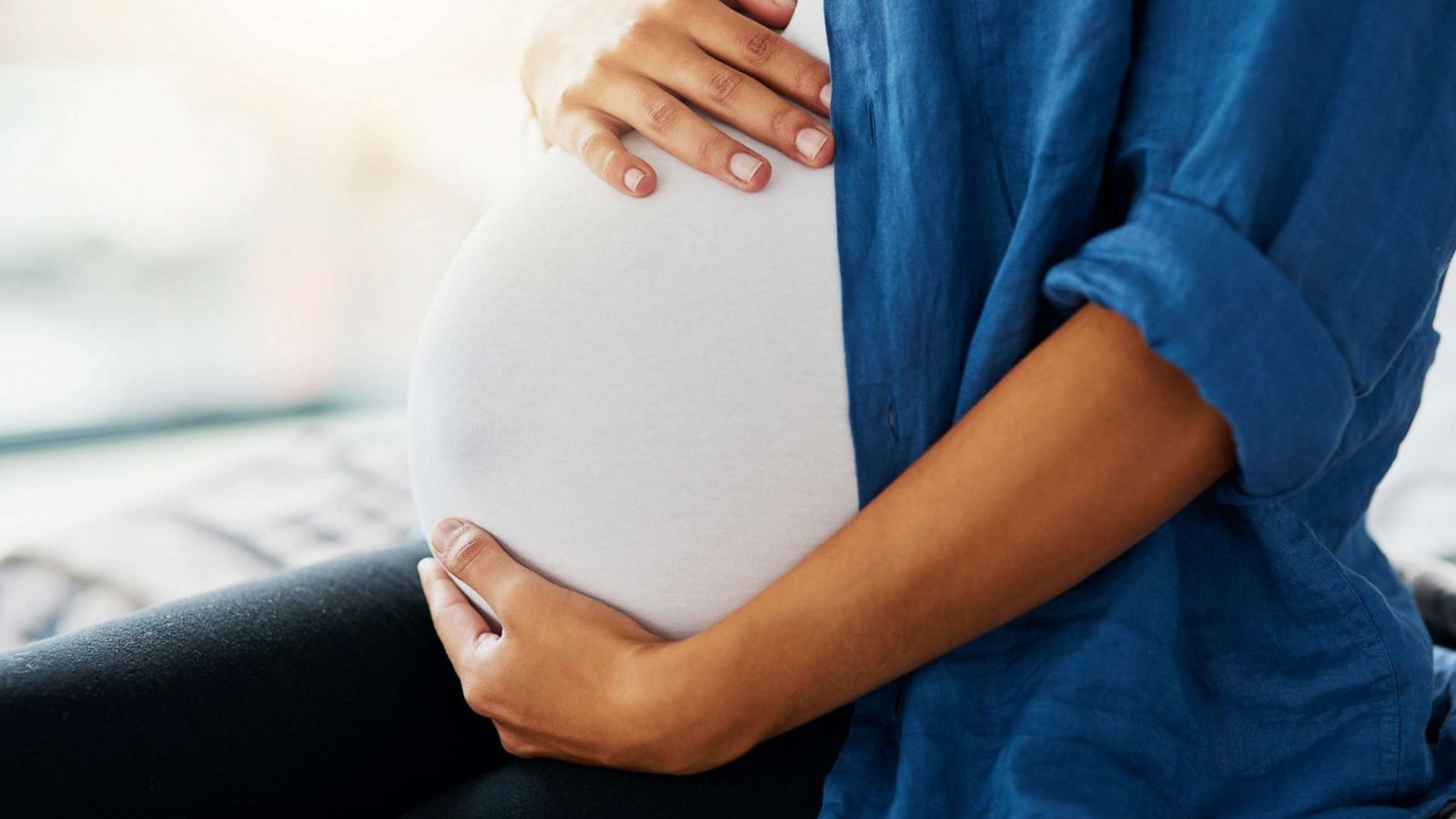 PHOTO: A woman holds her pregnant belly in this undated stock photo.