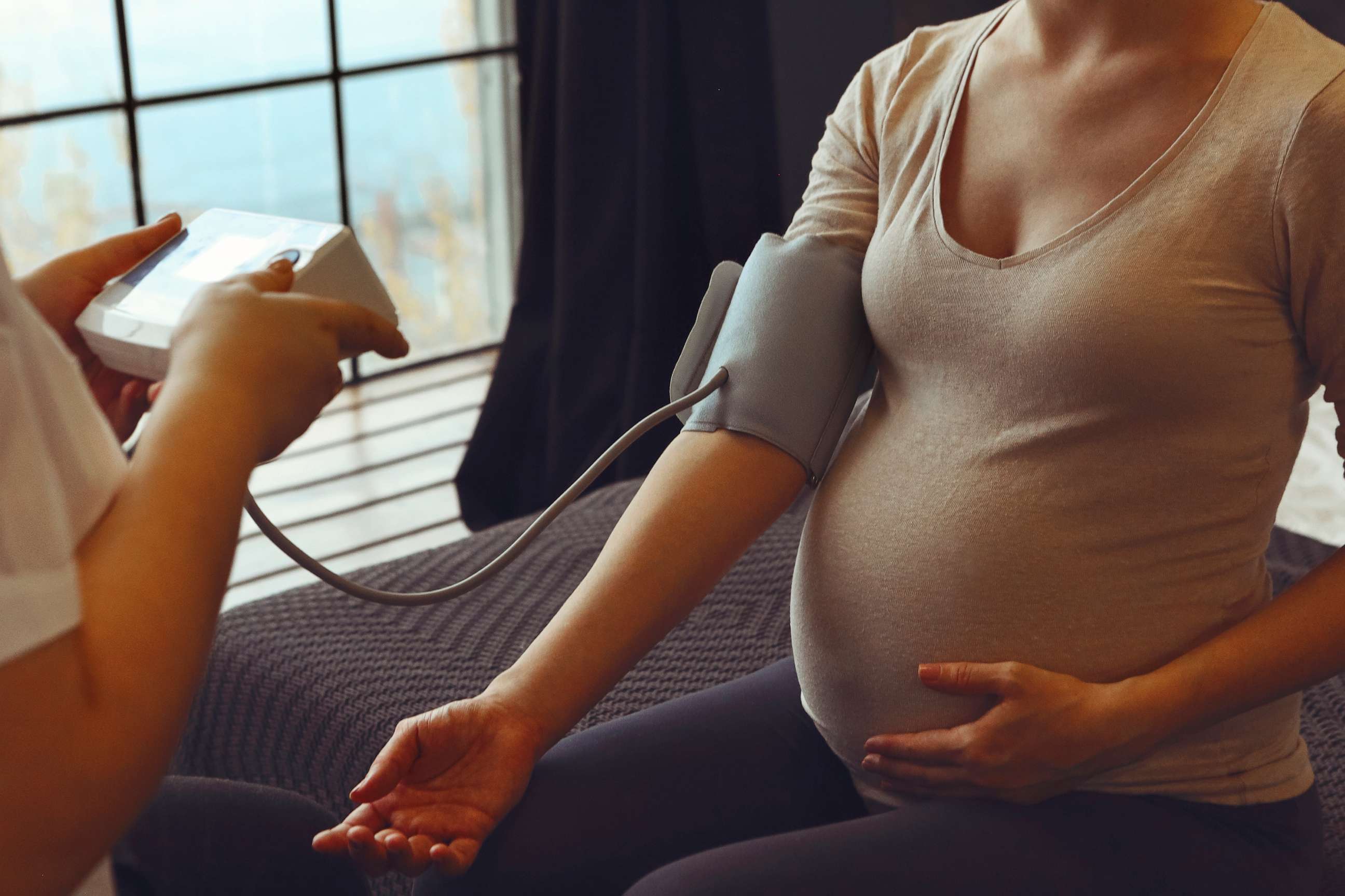 PHOTO: A pregnant woman sits with a Doctor in this undated stock photo.