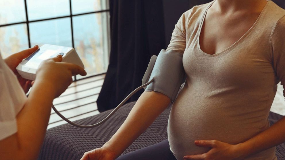 Pregnant Woman Reading Pregnancy Female On Chair With Book Waiting