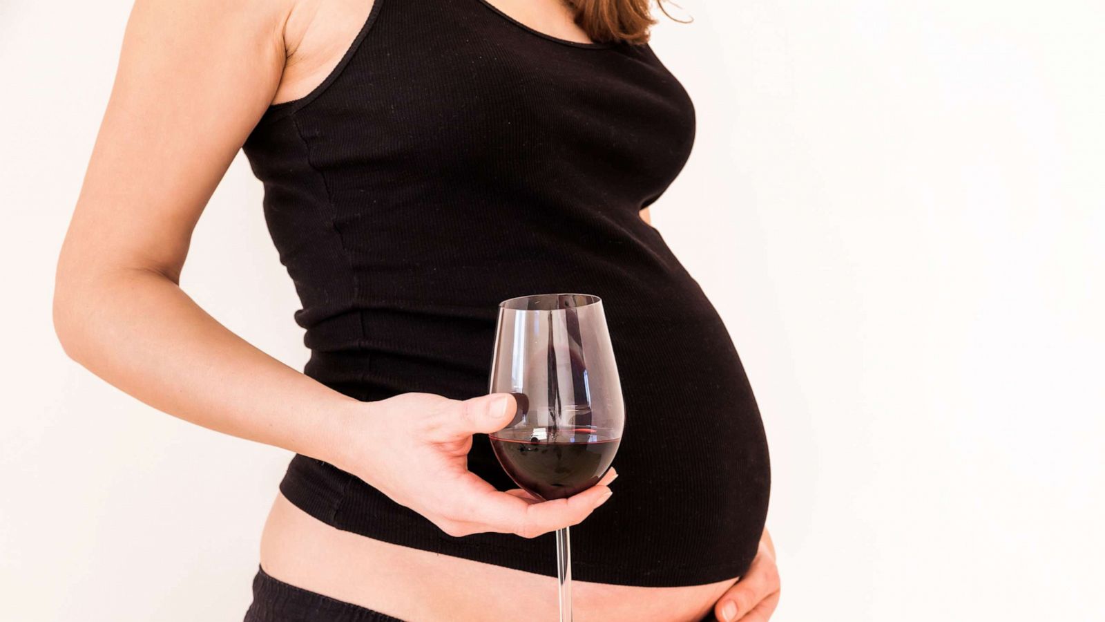 PHOTO: A pregnant woman holds wine in this stock photo.