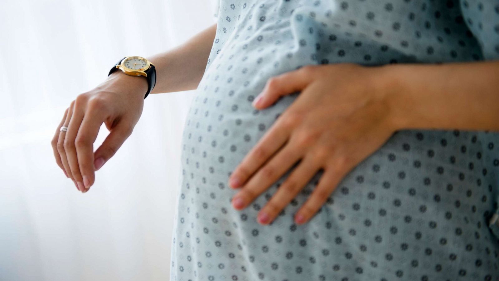 PHOTO: A pregnant woman holds her stomach in a stock photo.