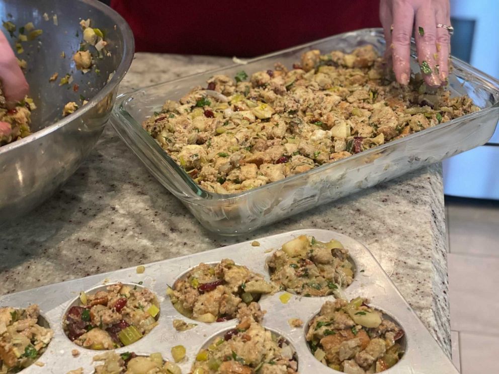 PHOTO: Stuffing goes into a buttered glass baking dish and muffin tins.