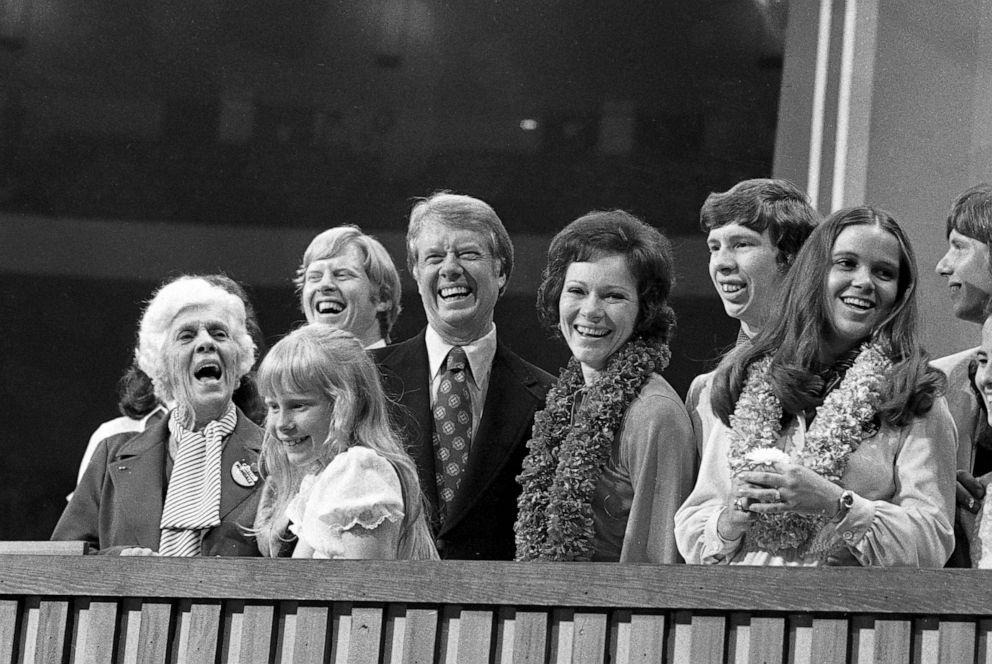 PHOTO: Democratic Presidential nominee, Jimmy Carter, and his wife, Rosalynn, are surrounded by family on the podium after Carter made his acceptance speech.