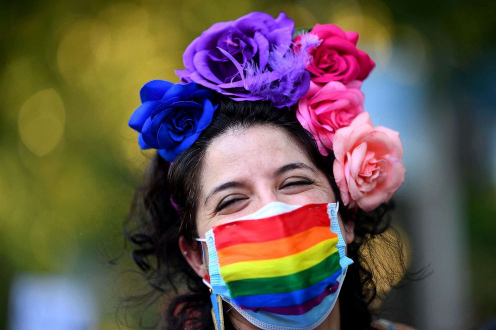 PHOTO: A demonstrator wearing a rainbow face mask attends the 2020 Critical Pride parade in Madrid, June 28, 2020.