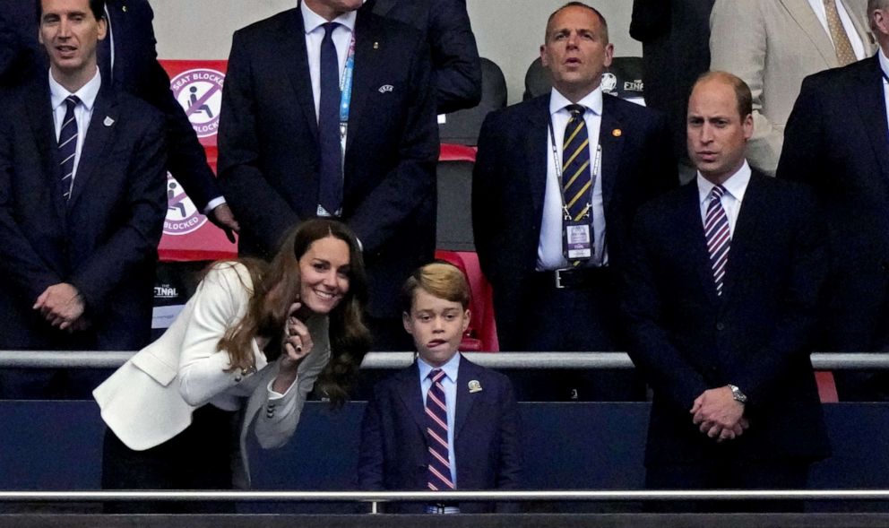 PHOTO: Catherine, Duchess of Cambridge speaks to Prince George while Britain's Prince William, Duke of Cambridge looks on while attending the Euro 2020 Championship Final game between Italy and England at Wembley Stadium on July 11, 2021 in London.