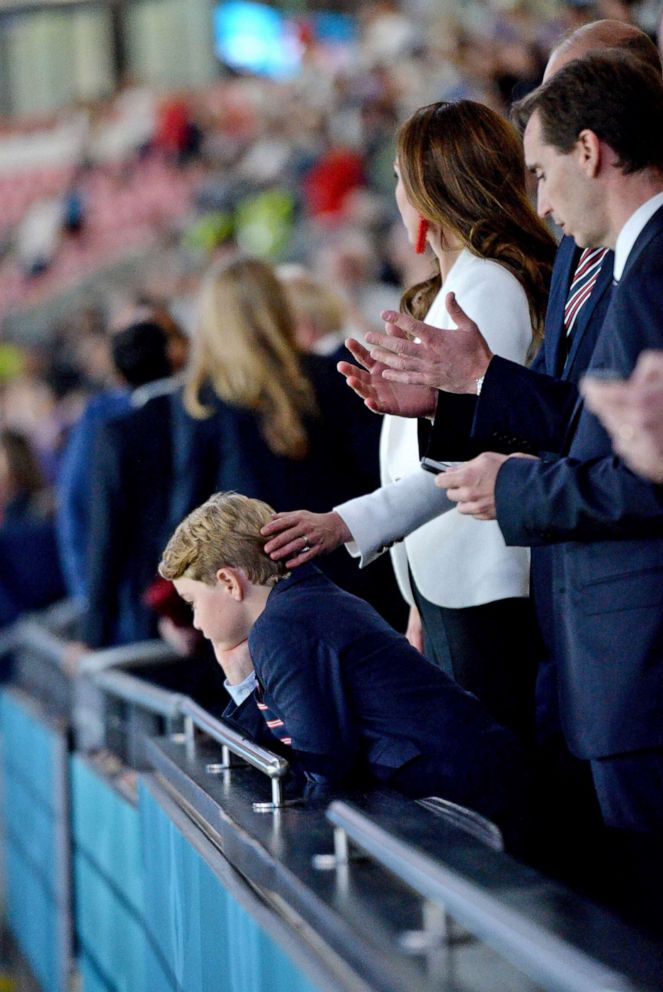 PHOTO: Britain's Prince William, Catherine, Duchess of Cambridge and Prince George attend the Euro 2020 Championship Final football game between Italy and England at Wembley Stadium on July 11, 2021 in London.