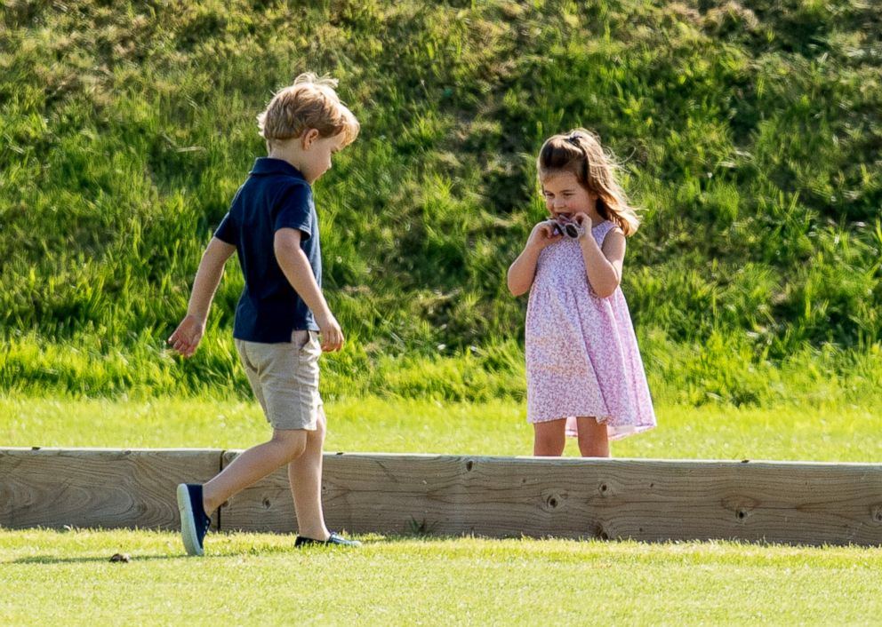 PHOTO: Prince George of Cambridge and Princess Charlotte of Cambridge during the Festival of Polo at the Beaufort Polo Club in Tetbury, Gloucestershire, England, June 10, 2018.