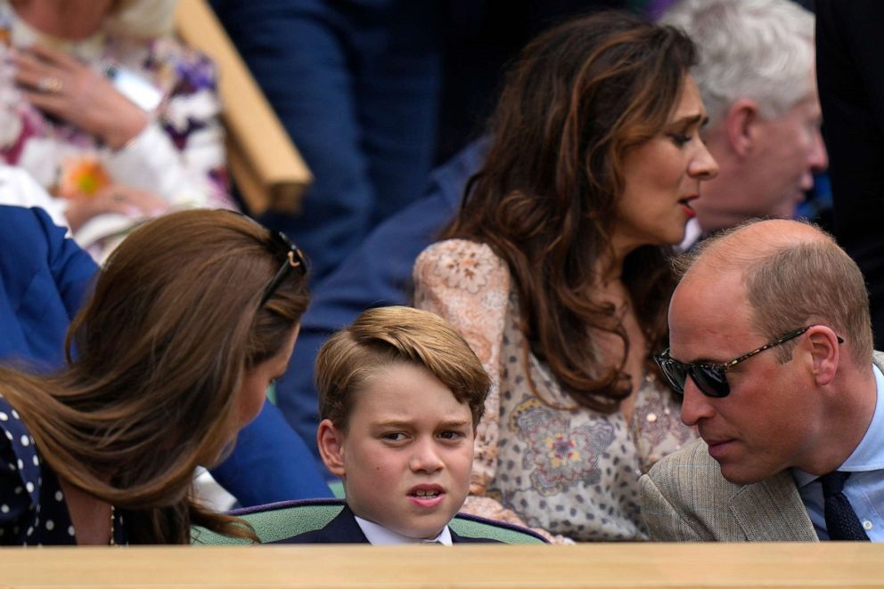 PHOTO: The Duke and Duchess of Cambridge talk to their son Prince George as they attend the men's singles final tennis match between Serbia's Novak Djokovic and Australia's Nick Kyrgios at the 2022 Wimbledon Championships in London, July 10, 2022.