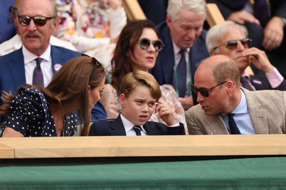 PHOTO:  The Duke and Duchess of Cambridge talk to their son Prince George as they attend the men's singles final tennis match between Serbia's Novak Djokovic and Australia's Nick Kyrgios at the 2022 Wimbledon Championships in London, July 10, 2022.