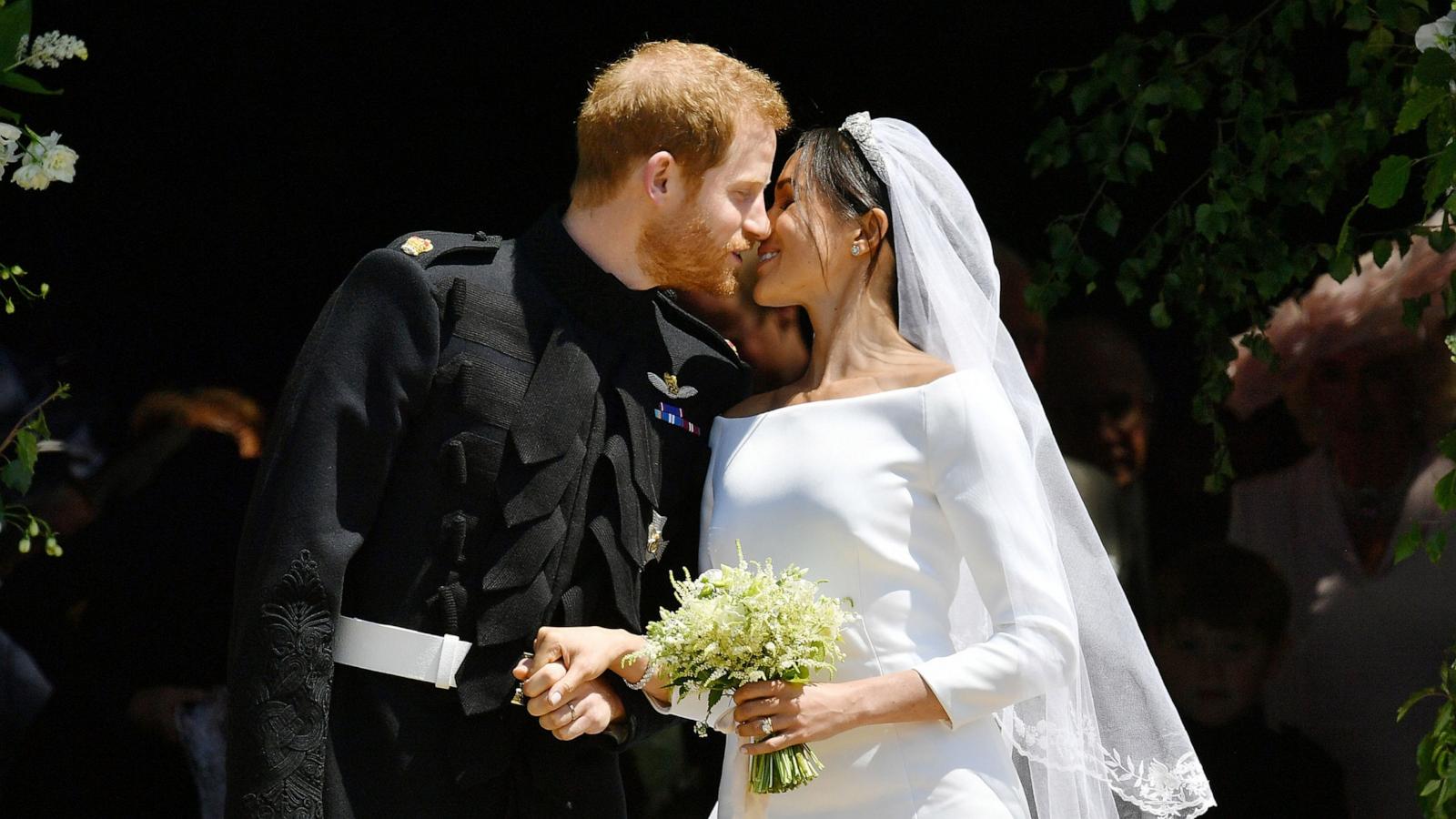 Prince Harry and Meghan Markle kiss on the steps of St George's Chapel in Windsor Castle after their wedding in St George's Chapel at Windsor Castle, May 19, 2018 in Windsor, England. 