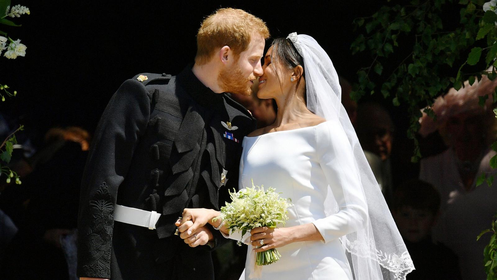 PHOTO: Prince Harry and Meghan Markle kiss on the steps of St George's Chapel in Windsor Castle after their wedding in St George's Chapel at Windsor Castle, May 19, 2018 in Windsor, England.