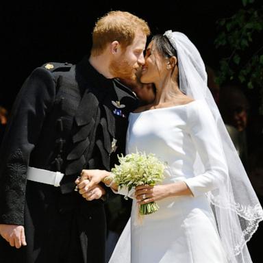 PHOTO: Prince Harry and Meghan Markle kiss on the steps of St George's Chapel in Windsor Castle after their wedding in St George's Chapel at Windsor Castle, May 19, 2018 in Windsor, England. 