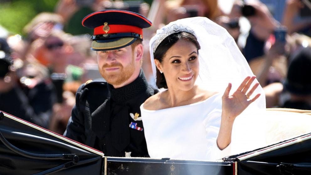 PHOTO: Prince Harry, Duke of Sussex and Meghan, Duchess of Sussex leave Windsor Castle in the Ascot Landau carriage during a procession after getting married at St Georges Chapel, May 19, 2018 in Windsor, England.
