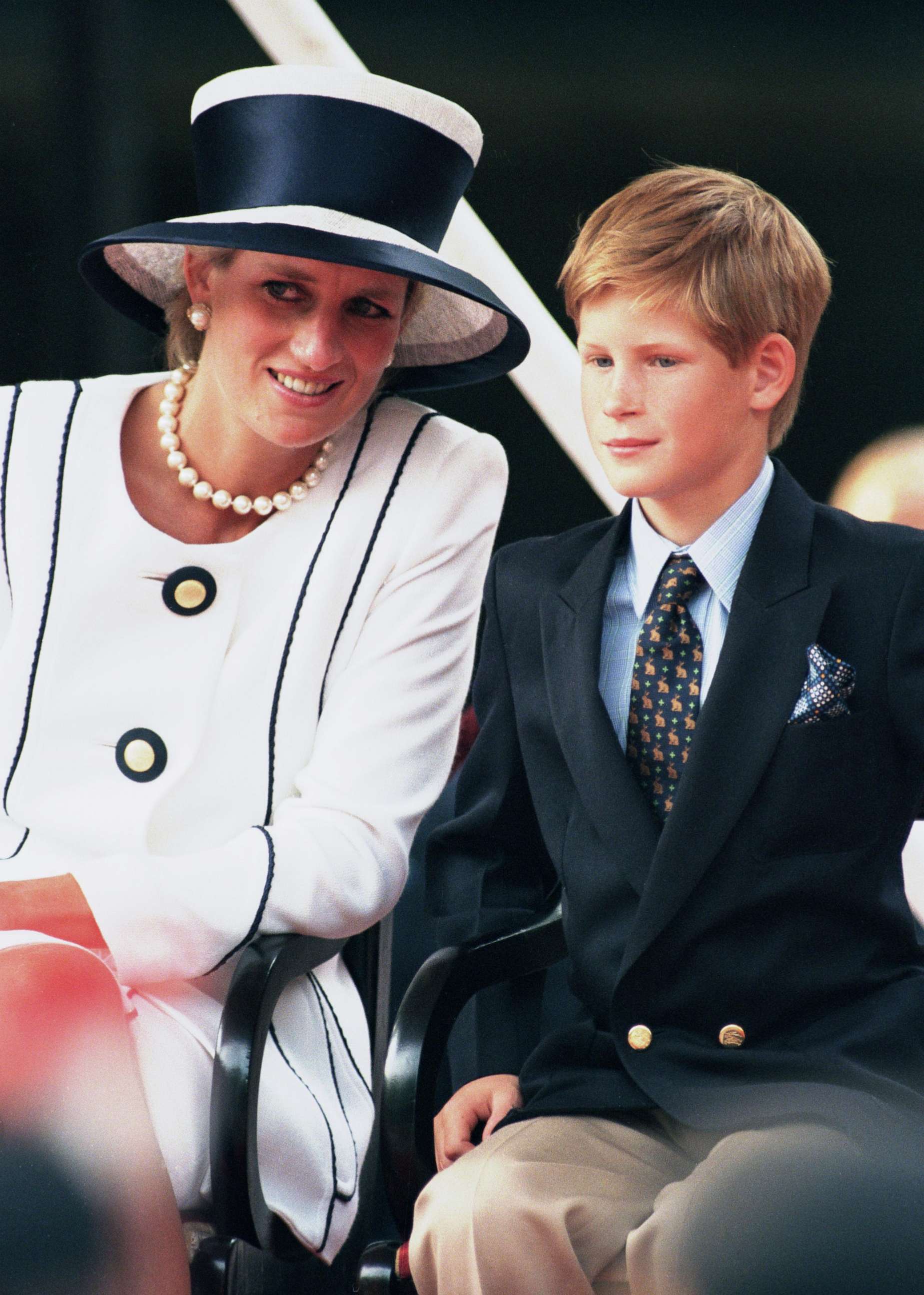 PHOTO: Diana, Princess Of Wales sits with Prince Harry while attending the 50th anniversary celebrations for VJ Day in London, Aug, 19, 1995.