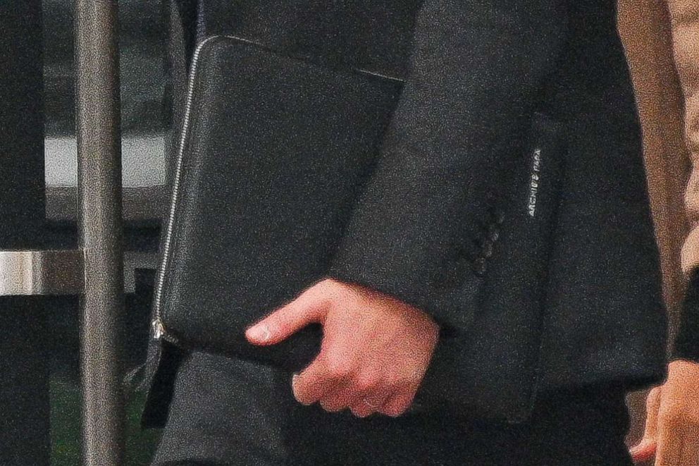 PHOTO: Prince Harry, Duke of Sussex, with a portfolio briefcase inscribed with "Archie's Papa," is seen leaving 50 United Nations Plaza on Sept. 23, 2021 in New York City.