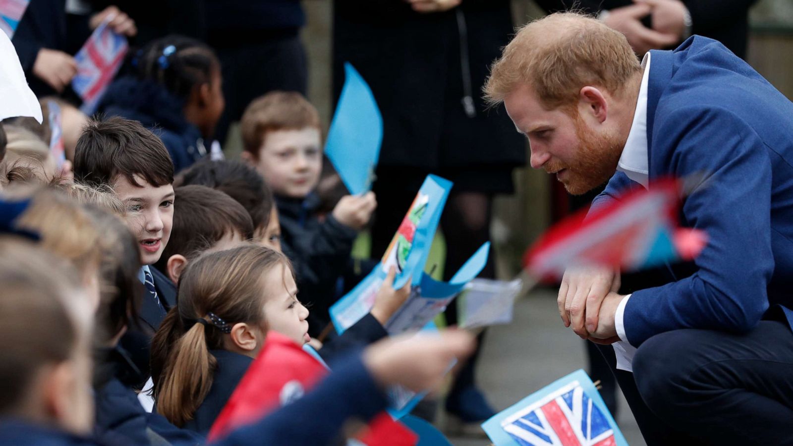 PHOTO: Prince Harry, Duke of Sussex greets school children after planting a tree from the Woodland Trust at St Vincent's Catholic Primary School, March 20, 2019, in Acton, England.