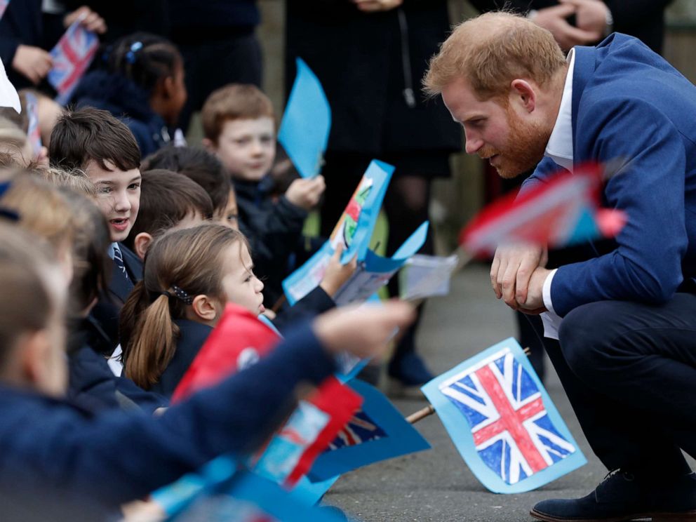 PHOTO: Prince Harry, Duke of Sussex greets school children after planting a tree from the Woodland Trust at St Vincent's Catholic Primary School, March 20, 2019, in Acton, England.