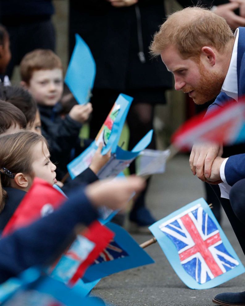 PHOTO: Prince Harry, Duke of Sussex greets school children after planting a tree from the Woodland Trust at St Vincent's Catholic Primary School, March 20, 2019, in Acton, England.