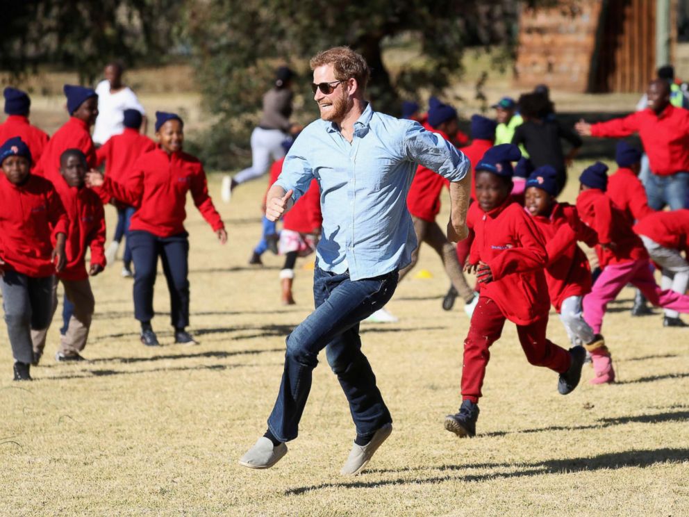 PHOTO: Prince Harry, Duke of Sussex and children run during Winter Camp at Sentebales Mamohato Childrens Centre on June 22, 2018 near Maseru, Lesotho.