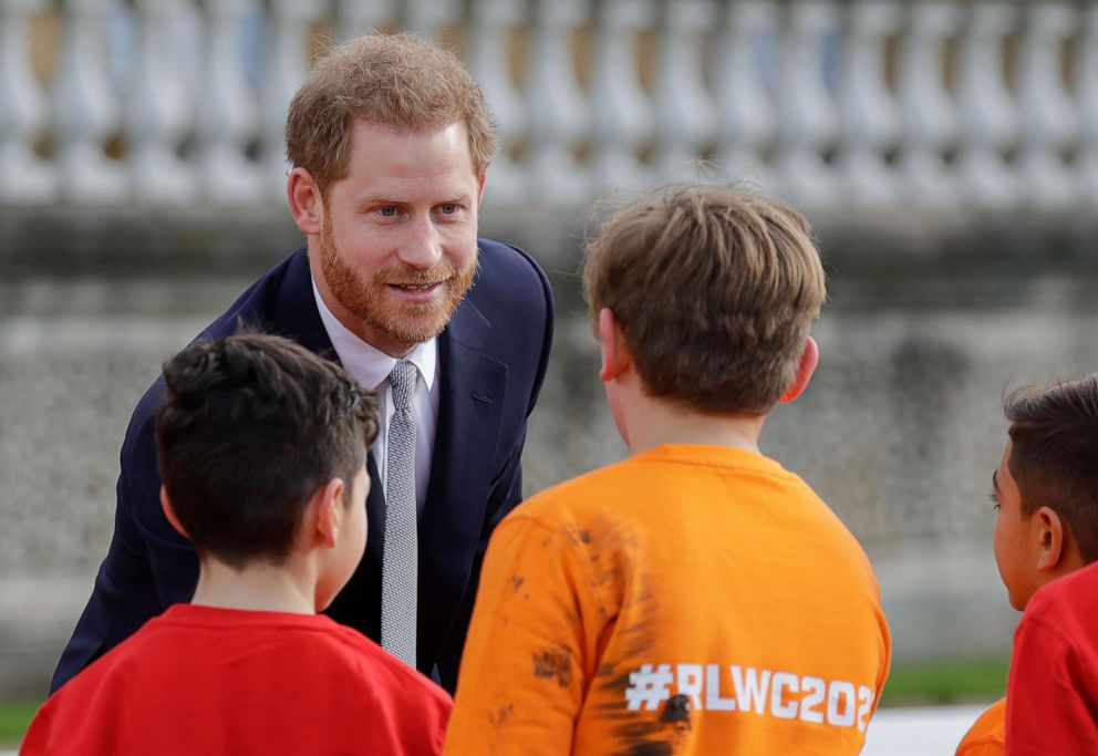 PHOTO: Britain's Prince Harry greets schoolchildren in the gardens at Buckingham Palace in London, Thursday, Jan. 16, 2020. 