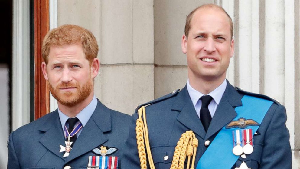 PHOTO: Prince Harry, Duke of Sussex and Prince William, Duke of Cambridge watch a flypast to mark the centenary of the Royal Air Force from the balcony of Buckingham Palace, July 10, 2018, in London.