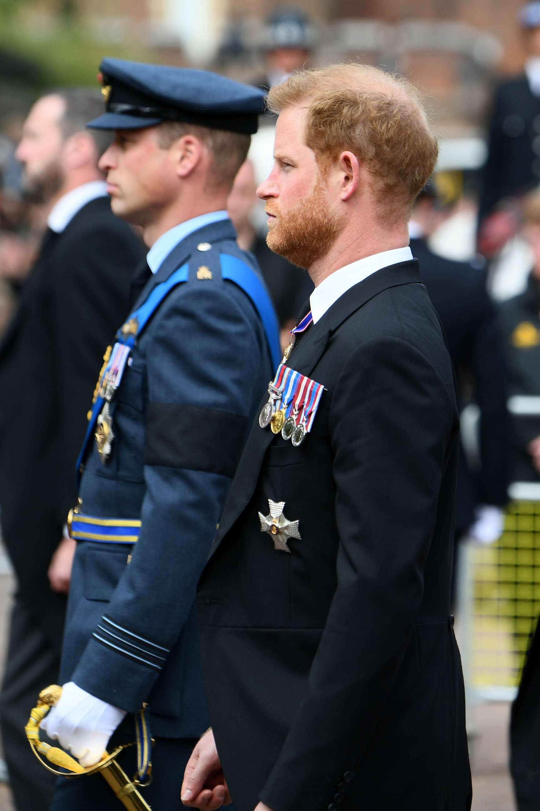 PHOTO: Left, Prince William, Prince of Wales and Prince Harry, Duke of Sussex follow Queen Elizabeth II's funeral cortege borne on the State Gun Carriage of the Royal Navy as it leaves Westminster Abbey on Sept. 19, 2022 in London.