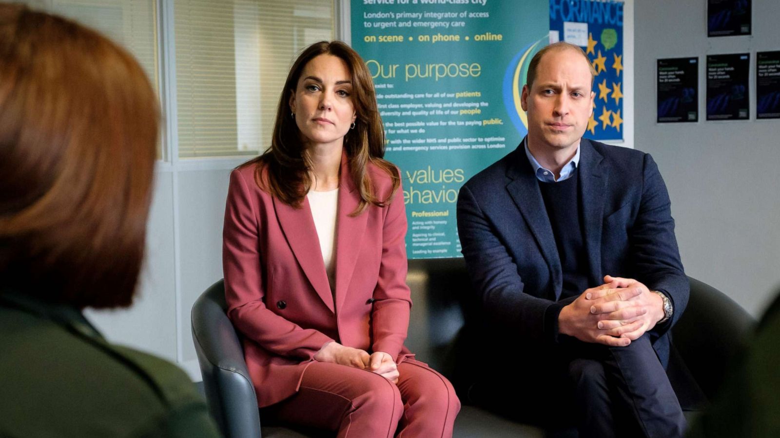 PHOTO: A handout photograph released by Kensington Palace on March 20, 2020, shows Britain's Prince William, Duke of Cambridge and Britain's Catherine, Duchess of Cambridge, during their visit to a London Ambulance Service control room south of London.