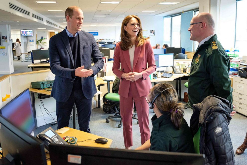 PHOTO: A handout photograph released by Kensington Palace on March 20, 2020, shows Britain's Prince William, Duke of Cambridge and Britain's Catherine, Duchess of Cambridge, during their visit to a London Ambulance Service control room south of London.