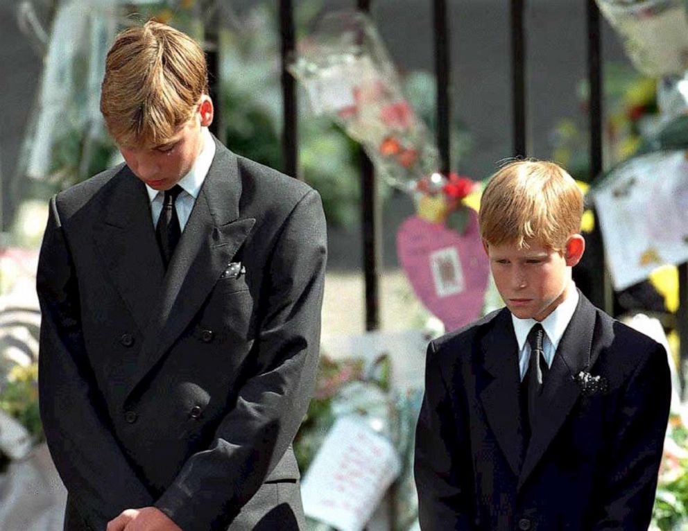 PHOTO: Prince William, left, and Prince Harry bow their heads as their mother's coffin is taken out of Westminster Abbey Sept. 6, 1997 following her funeral service.