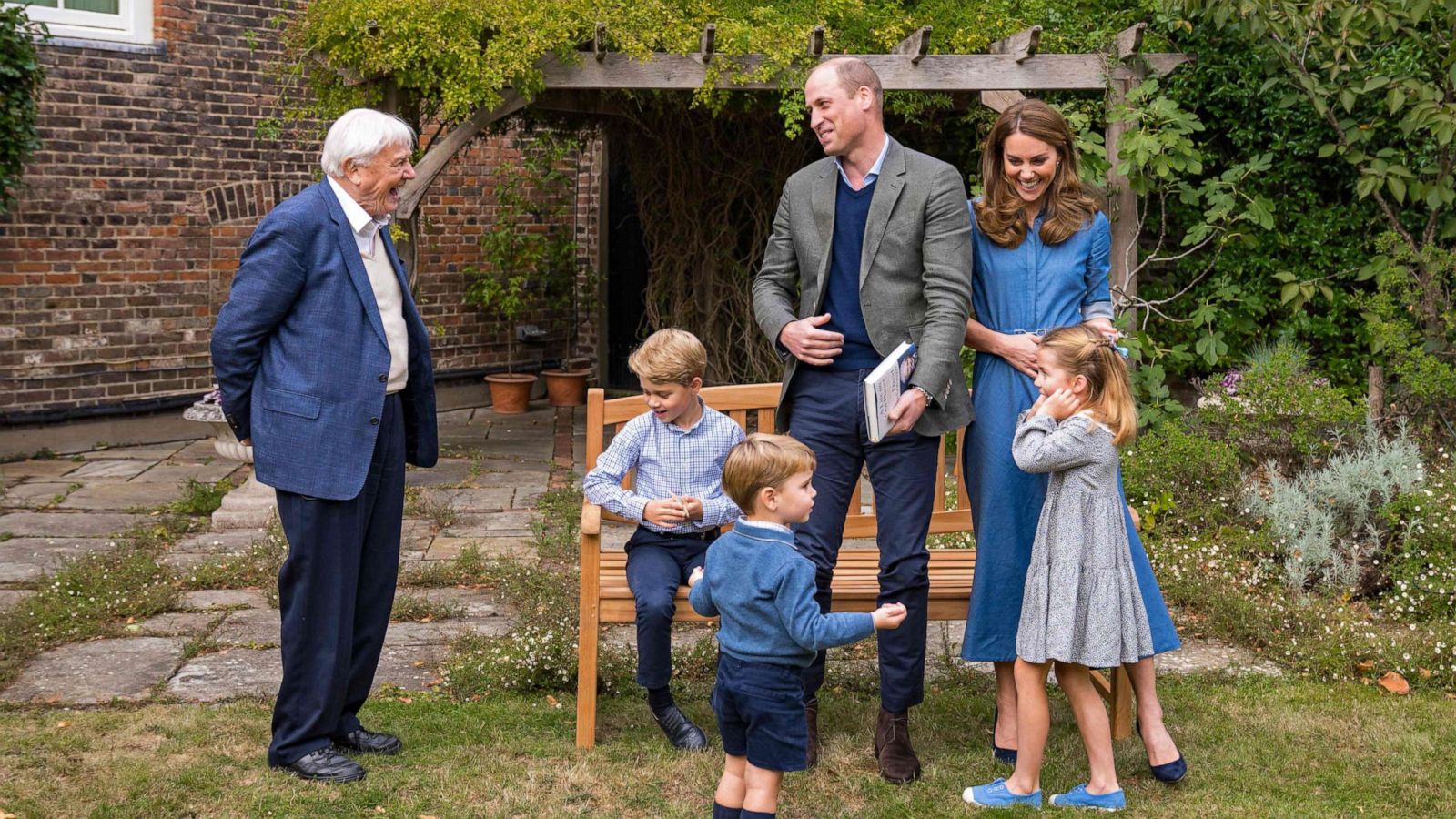 PHOTO: Prince William, Catherine, Duchess of Cambridge, Prince George, Princess Charlotte and Prince Louis with Sir David Attenborough in the gardens of Kensington Palace in London.