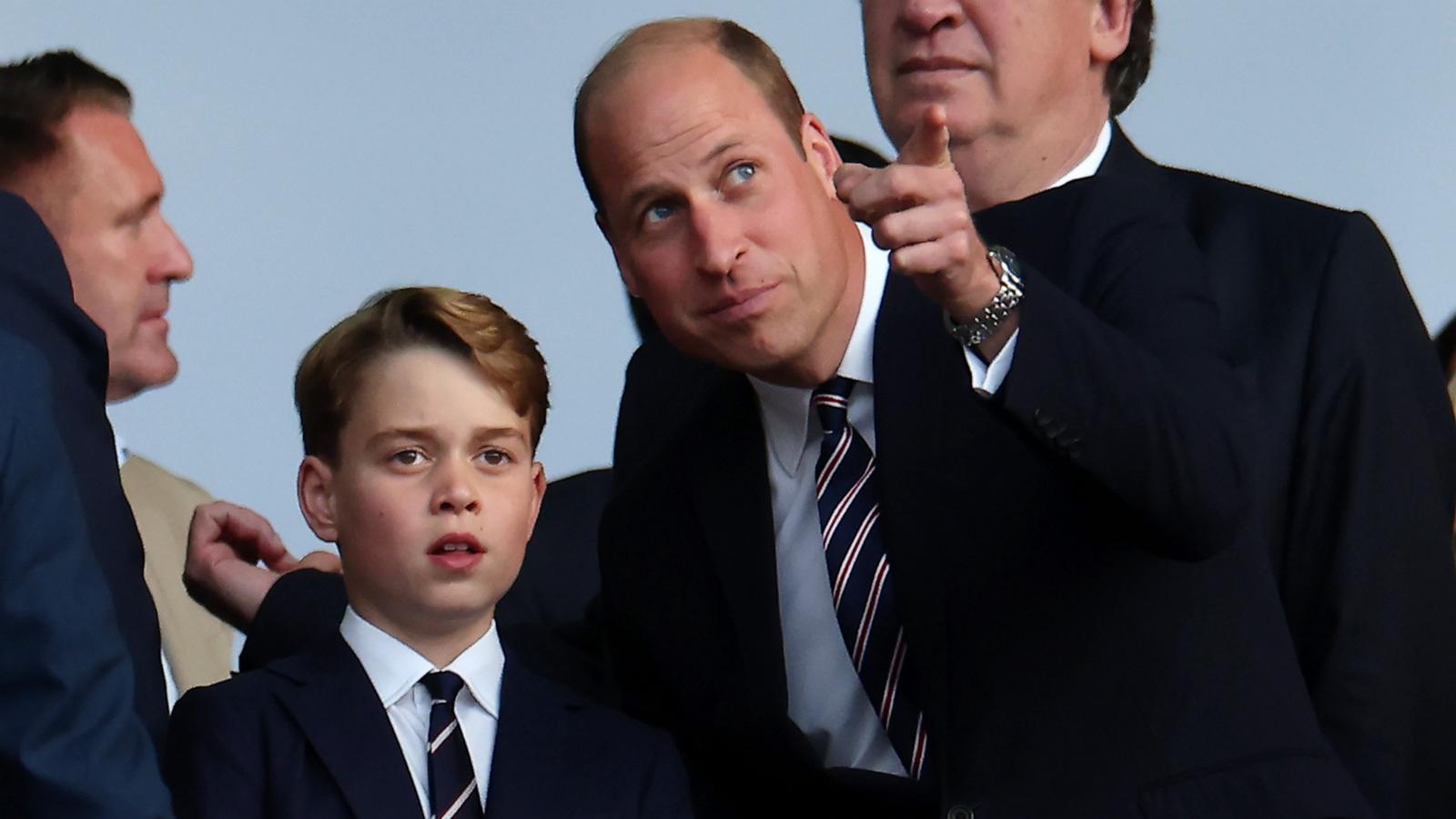 PHOTO: Prince William, Prince of Wales and President of The FA, and his son Prince George of Wales look on from the stands prior the UEFA EURO 2024 final match between Spain and England at Olympiastadion on July 14, 2024 in Berlin.