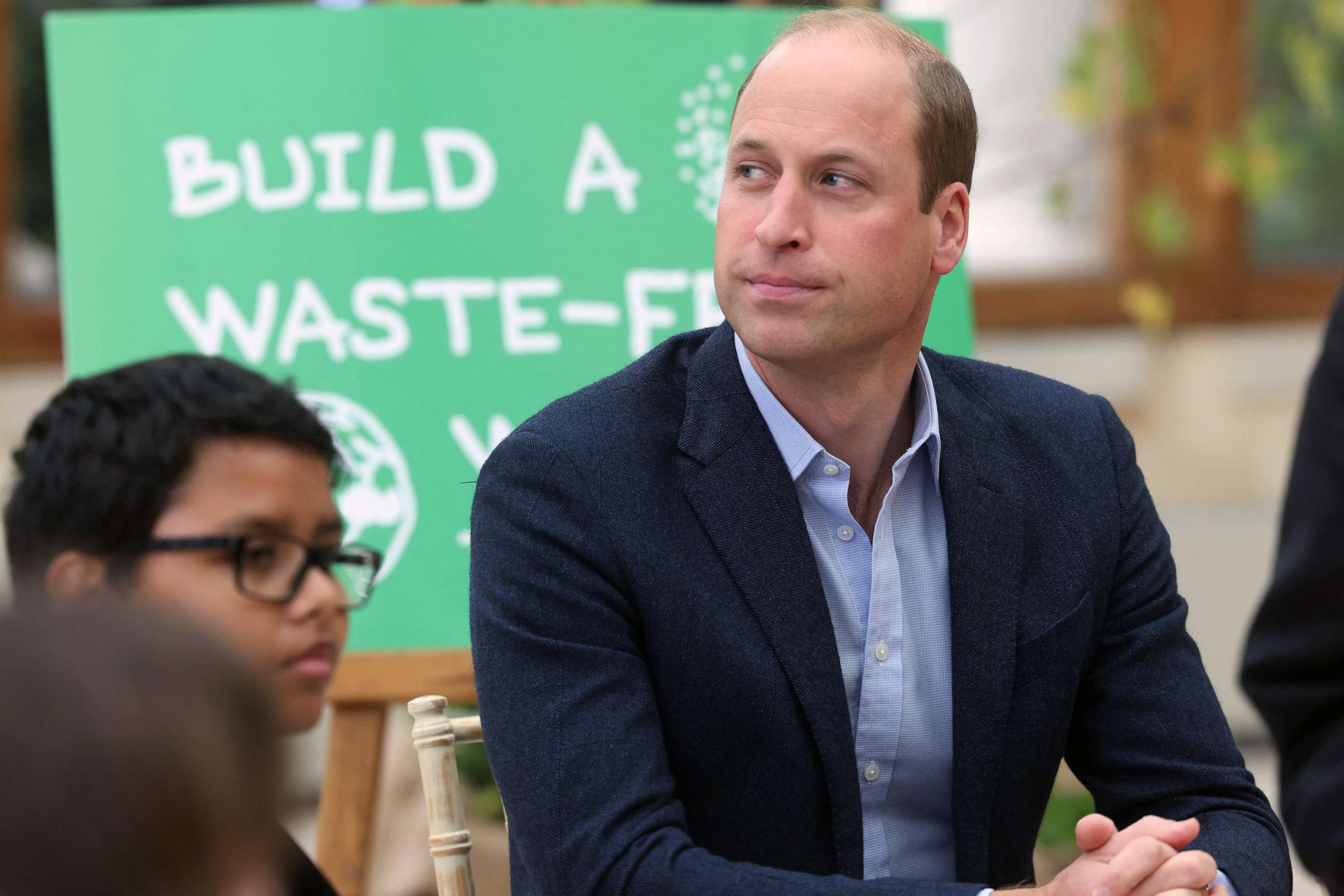 PHOTO: Britain's Prince William, Duke of Cambridge interacts with children from The Heathlands School, Hounslow during a visit at Kew Gardens, London, Oct. 13, 2021.