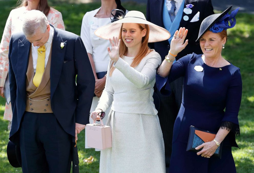 PHOTO: Prince Andrew, Duke of York bows his head while Princess Beatrice and Sarah, Duchess of York wave to Queen Elizabeth II as she and her guests pass by in horse drawn carriages on June 22, 2018, in Ascot, England.