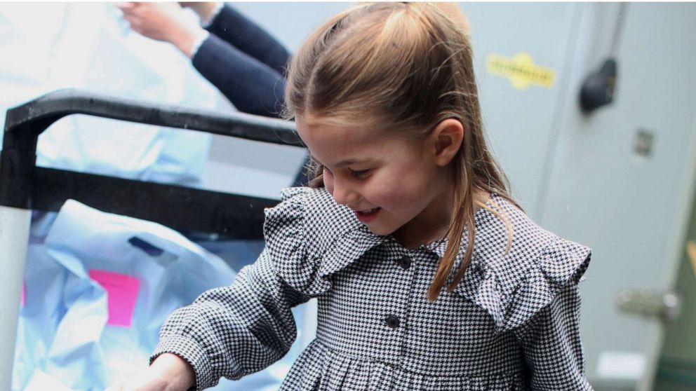 PHOTO: Princess Charlotte helps to pack up and deliver food packages for isolated pensioners in the local area along with her family.