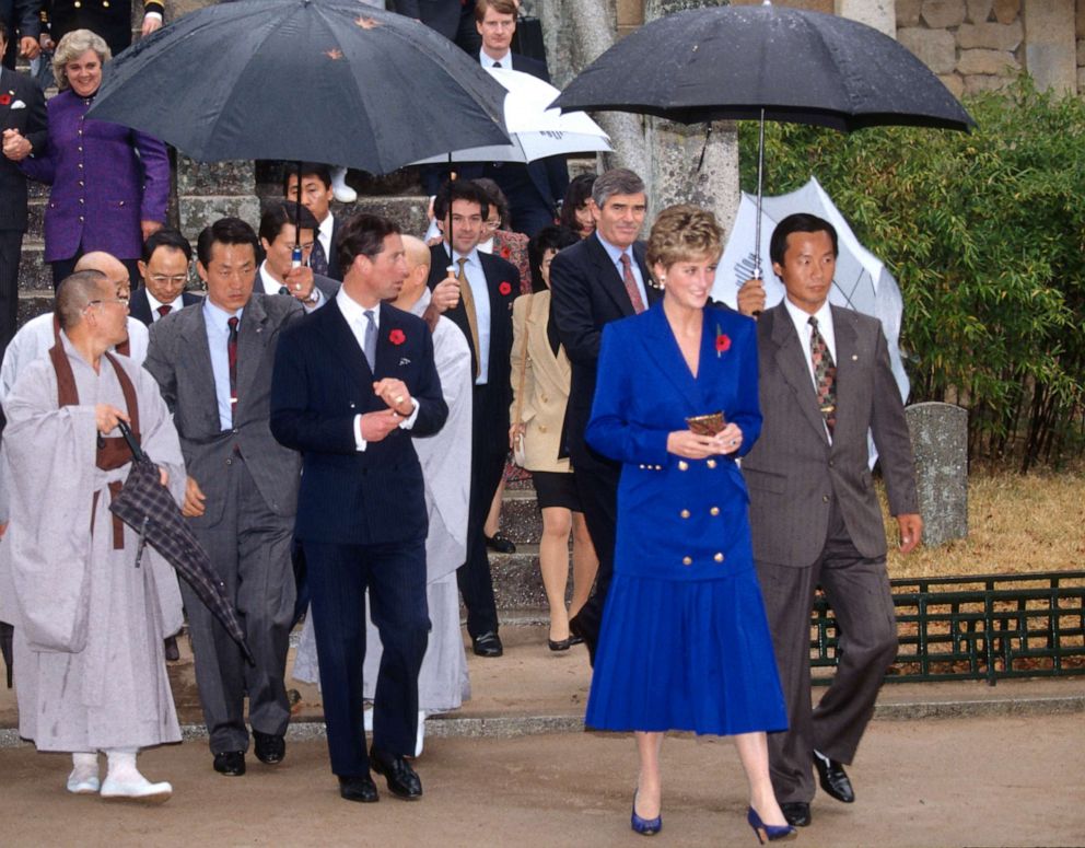 PHOTO: Prince Charles and Diana, Princess of Wales, wearing a blue pleated skirt and jacket with gold buttons, visit the Bulguksa Buddhist temple on Nov. 5, 1992, in Gyeongju, South Korea.