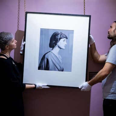 PHOTO: Conservators hang David Bailey's photograph of Diana, Princess of Wales in an undated photo.