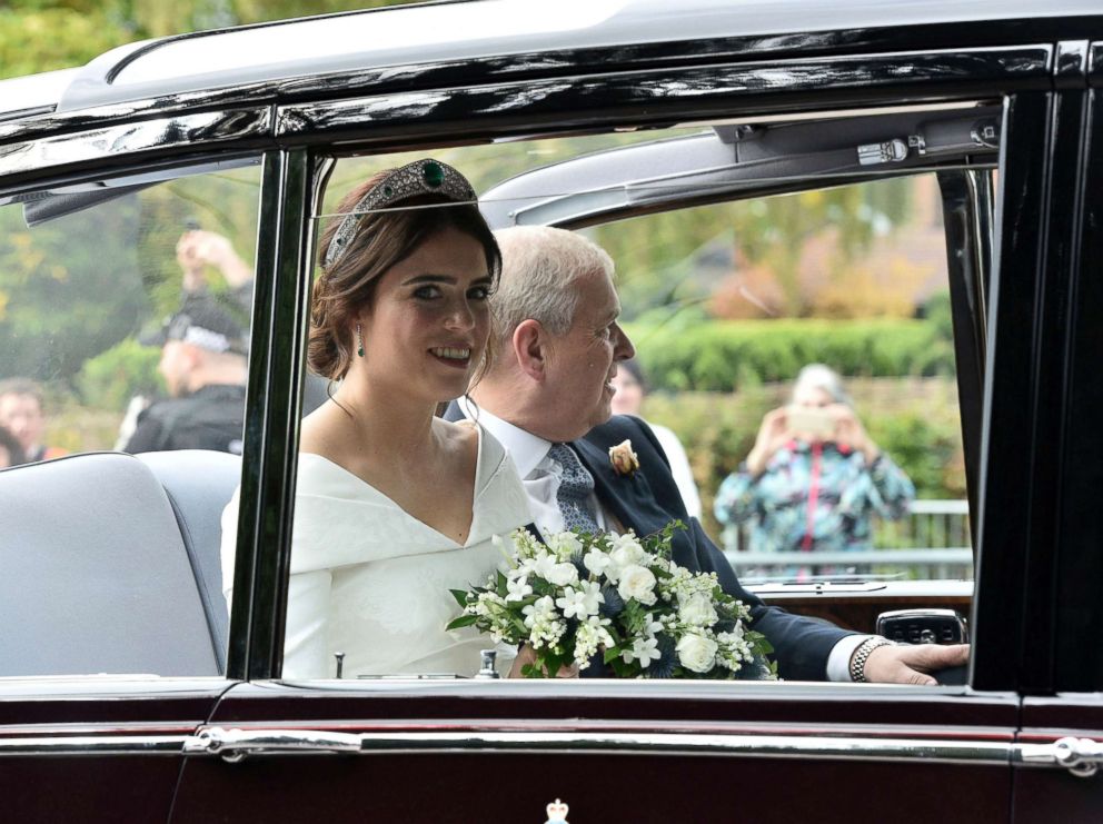 PHOTO: Princess Eugenie of York, left, arrives with her father Prince Andrew, Duke of York for her wedding with Jack Brooksbank in St George's Chapel, Windsor Castle, England, Oct 12, 2018. 