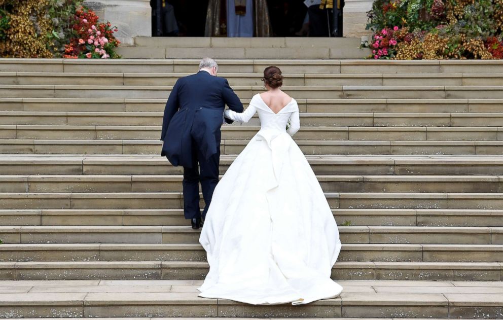 PHOTO: Britain's Princess Eugenie arrives accompanied by her father Prince Andrew, Duke of York, at St George's Chapel for her wedding to Jack Brooksbank in Windsor Castle, Oct. 12, 2018.