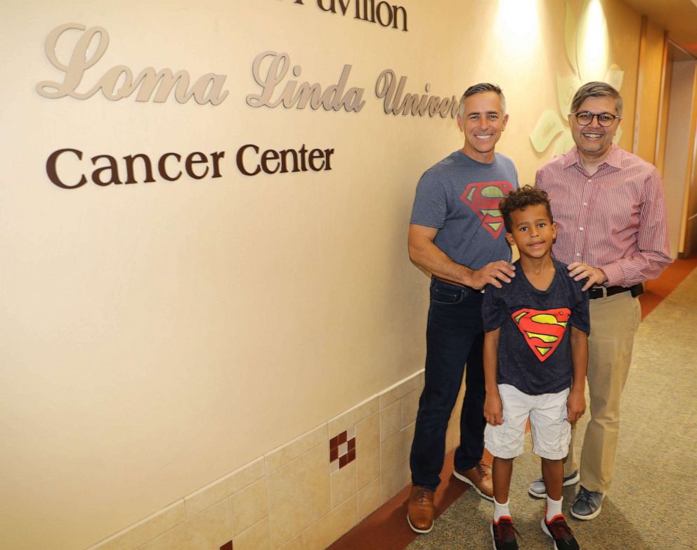 PHOTO: Jeff Sipos poses in a recent photo with first grader Jackson Todd, and his oncologist Dr. Muhammad Omair Kamal.